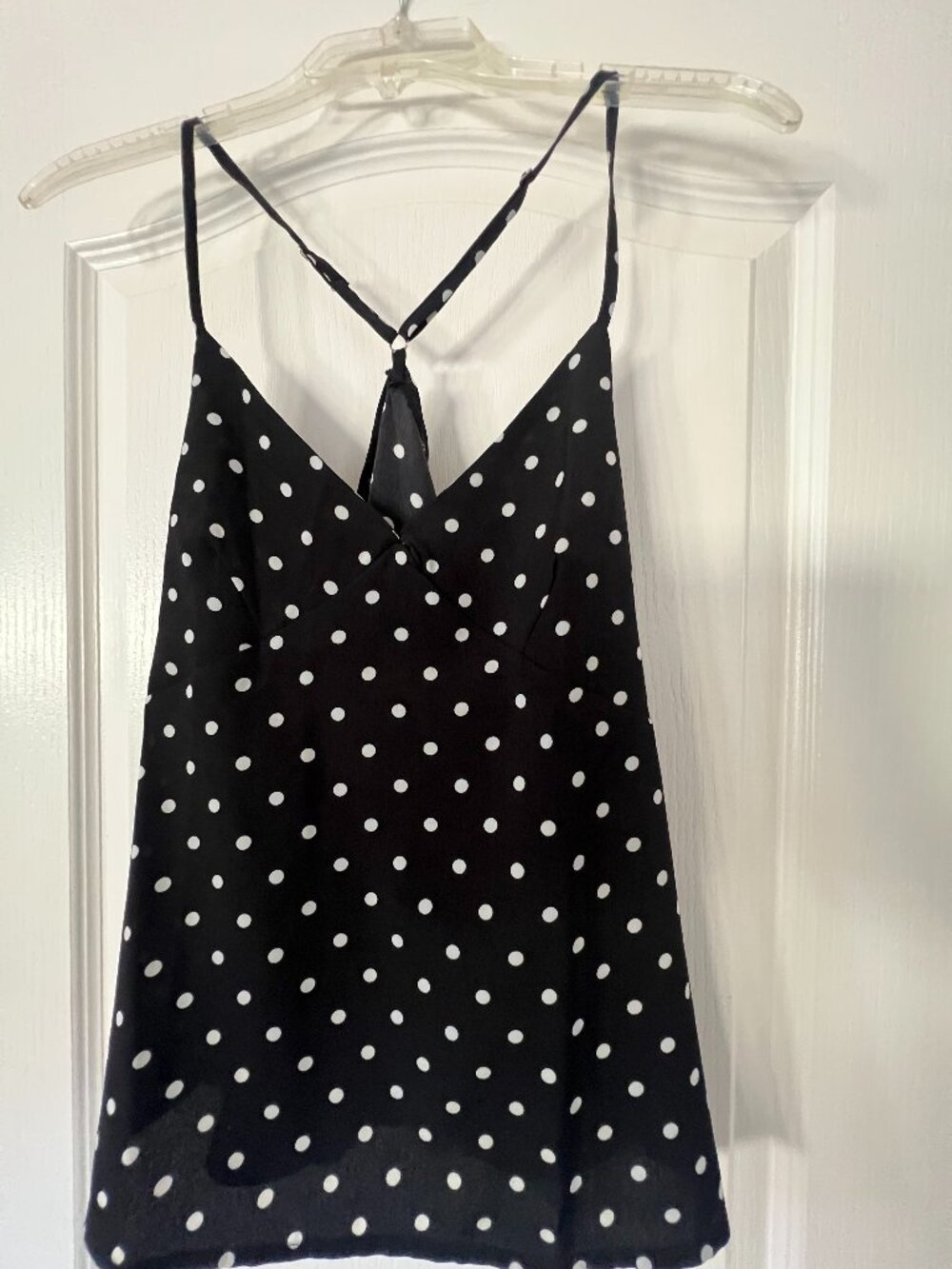Adorable black and white polka dot, sleeveless blouse, Size Small, New Condition